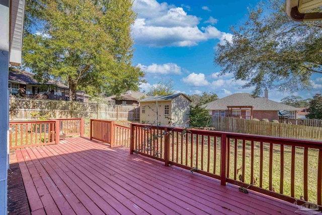 wooden terrace with a storage shed