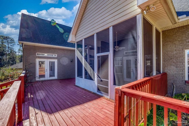 wooden terrace featuring a sunroom