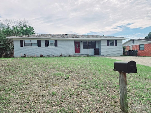 ranch-style home featuring a front yard, crawl space, and brick siding