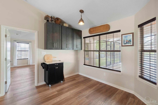 420 Palm Lake Dr, Pensacola, FL 32507 - unfurnished dining area featuring light wood-type flooring and baseboards