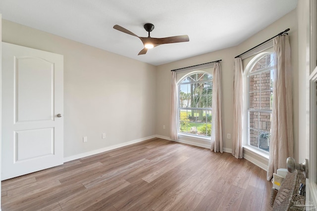 420 Palm Lake Dr, Pensacola, FL 32507 - empty room with light wood-style floors, baseboards, and ceiling fan
