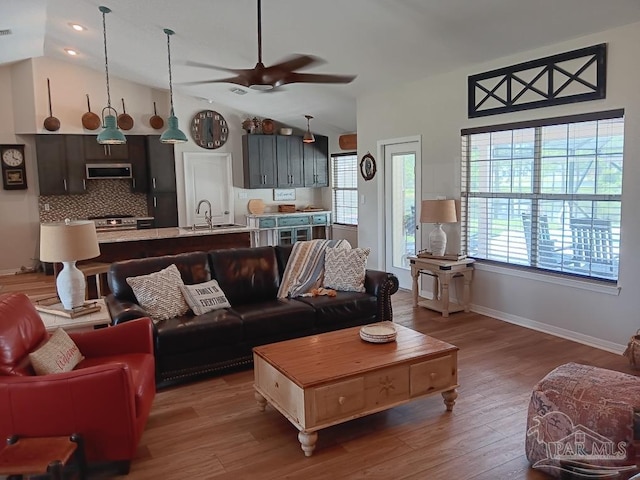 420 Palm Lake Dr, Pensacola, FL 32507 - living room featuring lofted ceiling, a ceiling fan, wood finished floors, baseboards, and recessed lighting