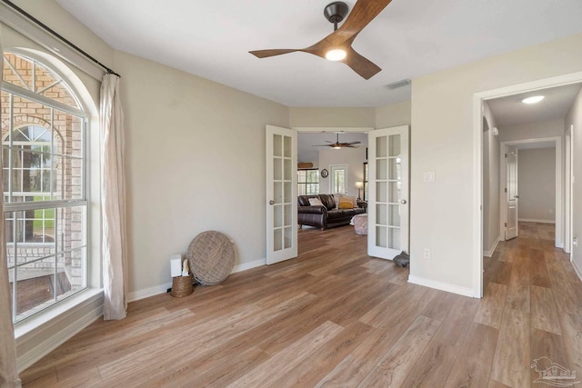 420 Palm Lake Dr, Pensacola, FL 32507 - unfurnished room featuring french doors, a ceiling fan, light wood-type flooring, and baseboards