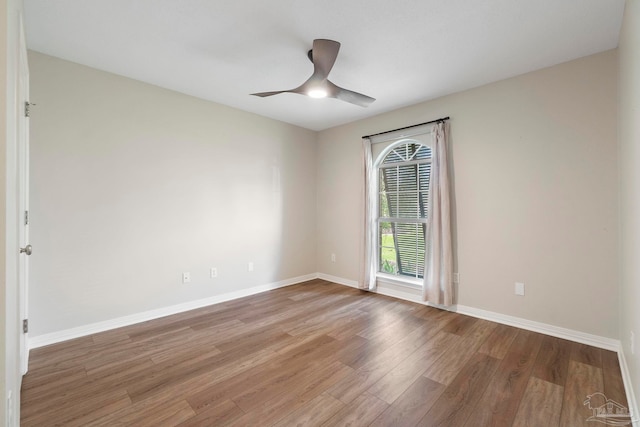 420 Palm Lake Dr, Pensacola, FL 32507 - empty room featuring wood finished floors, baseboards, and a ceiling fan