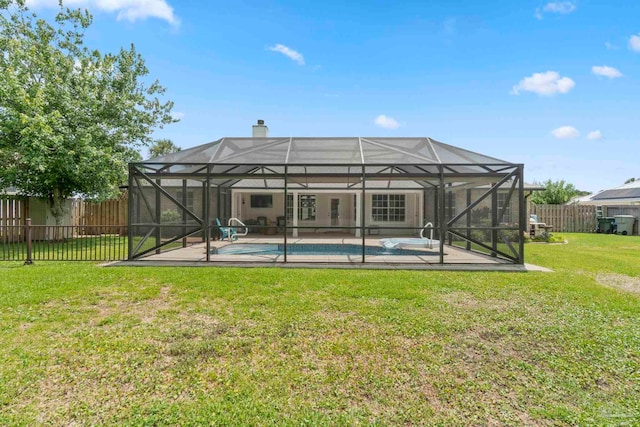 420 Palm Lake Dr, Pensacola, FL 32507 - back of property with a chimney, a patio, and glass enclosure