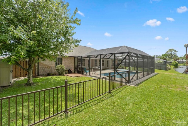 420 Palm Lake Dr, Pensacola, FL 32507 - back of house with a patio, brick siding, and glass enclosure