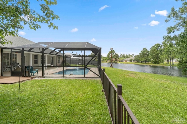 420 Palm Lake Dr, Pensacola, FL 32507 - view of grassy yard with a water view, a patio, an outdoor pool, and glass enclosure
