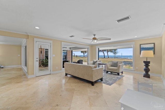 living room featuring ornamental molding, visible vents, and baseboards