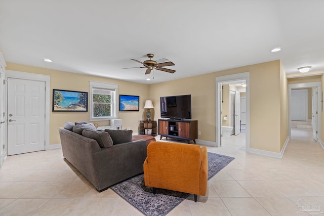 living room featuring a ceiling fan, recessed lighting, baseboards, and light tile patterned floors