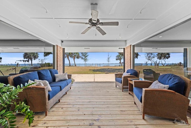 deck featuring ceiling fan and outdoor lounge area