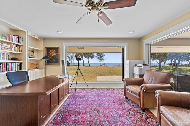 interior space featuring a ceiling fan