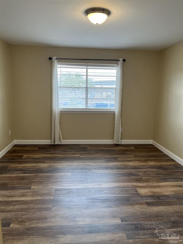 empty room featuring dark hardwood / wood-style floors