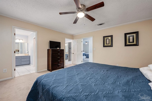 tiled bedroom featuring a textured ceiling, connected bathroom, ceiling fan, and crown molding