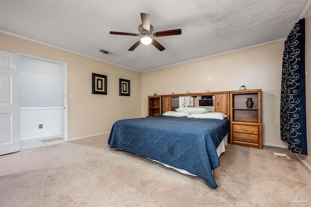 bedroom featuring crown molding, a textured ceiling, ceiling fan, and carpet flooring