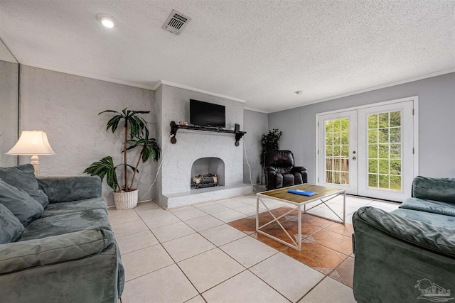 tiled living room featuring ornamental molding, a fireplace, and a textured ceiling