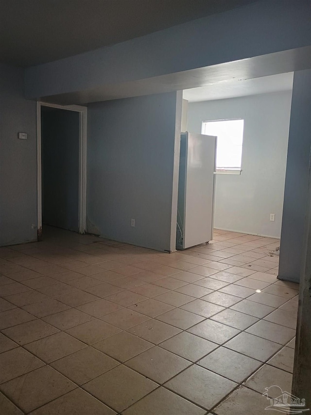 empty room with light tile patterned flooring