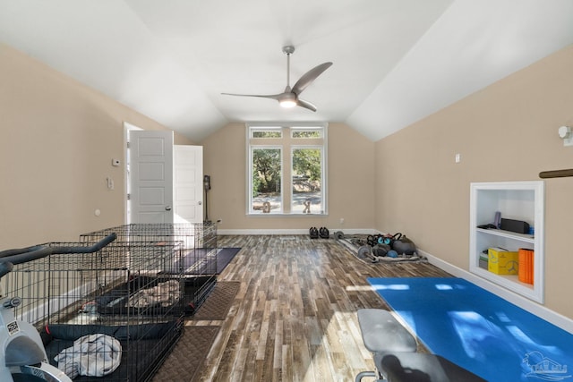 bonus room with ceiling fan, hardwood / wood-style floors, vaulted ceiling, and built in shelves