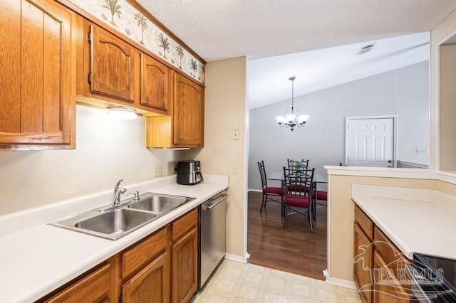 2299 Scenic Hwy Unit T7, Pensacola, FL 32503 - kitchen featuring stainless steel dishwasher, a sink, brown cabinetry, light countertops, and vaulted ceiling