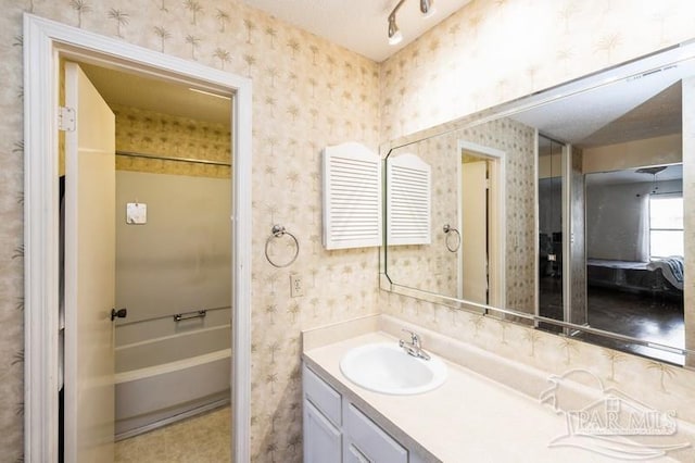 2299 Scenic Hwy Unit T7, Pensacola, FL 32503 - bathroom featuring wallpapered walls, vanity, and shower / washtub combination