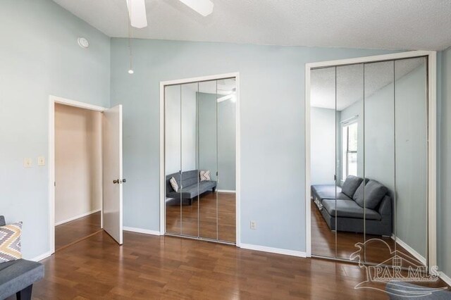 2299 Scenic Hwy Unit T7, Pensacola, FL 32503 - bedroom featuring lofted ceiling, two closets, wood finished floors, baseboards, and a ceiling fan