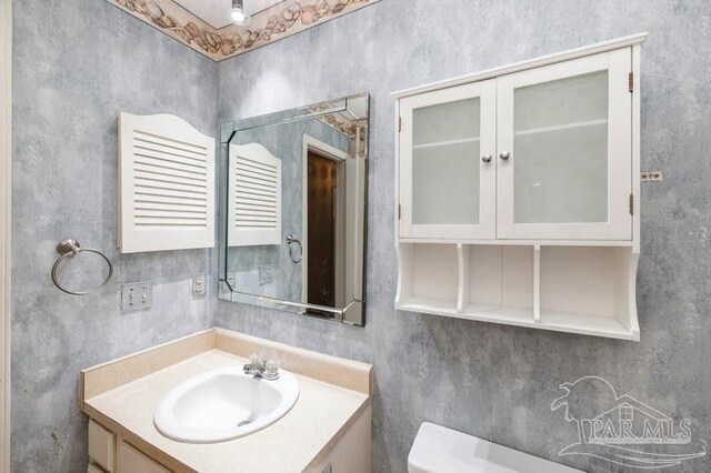 2299 Scenic Hwy Unit T7, Pensacola, FL 32503 - bathroom featuring toilet and vanity