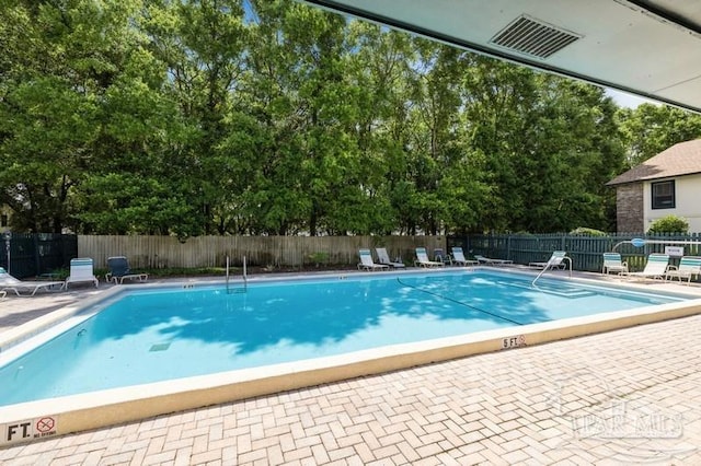 2299 Scenic Hwy Unit T7, Pensacola, FL 32503 - community pool with view of wooded area and a patio