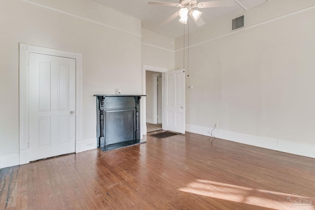 unfurnished living room featuring hardwood / wood-style flooring and ceiling fan