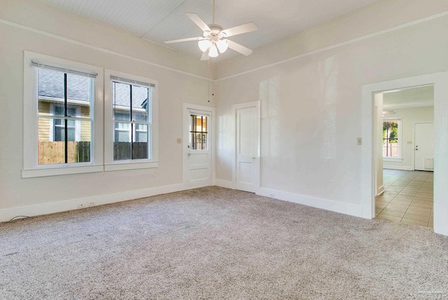 spare room with light carpet and ceiling fan