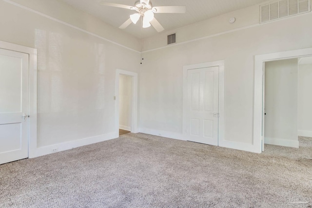 unfurnished bedroom featuring carpet flooring and ceiling fan