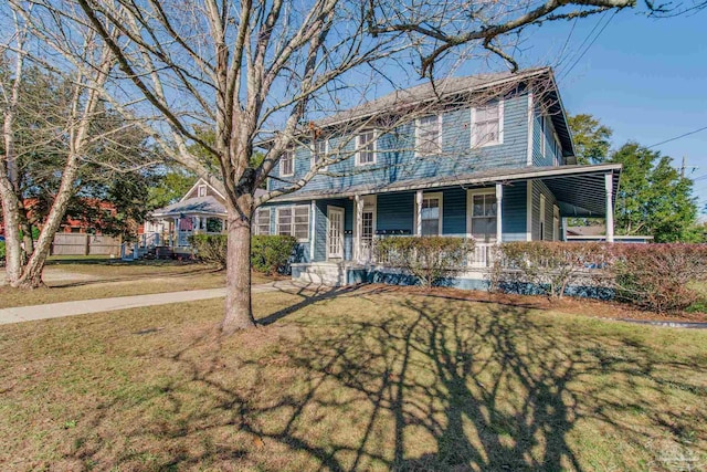 view of front facade with a porch and a front yard