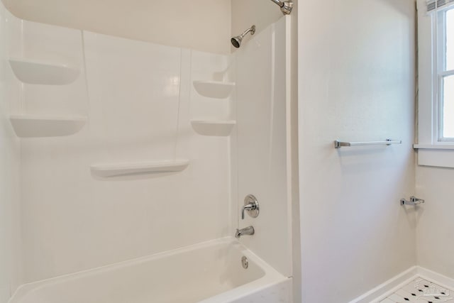 bathroom with bathtub / shower combination and tile patterned floors