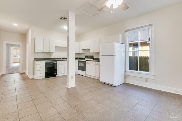 kitchen with plenty of natural light, white cabinets, white appliances, and light tile patterned floors