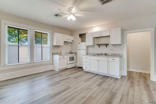 kitchen with light wood-type flooring, white appliances, white cabinetry, and sink