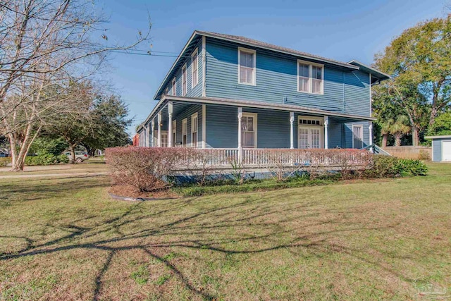 exterior space with a front yard and a porch