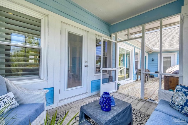 sunroom with wood finished floors