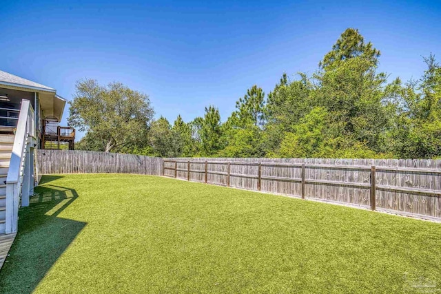 view of yard with a fenced backyard