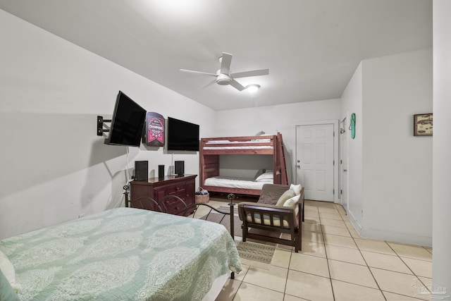 bedroom with light tile patterned floors, baseboards, and a ceiling fan
