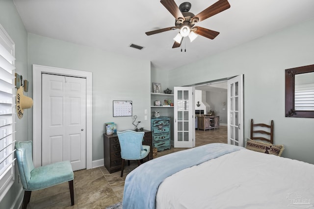 bedroom with a closet, baseboards, visible vents, a ceiling fan, and french doors