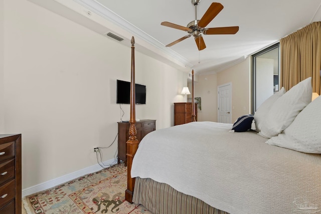 bedroom featuring ceiling fan and ornamental molding