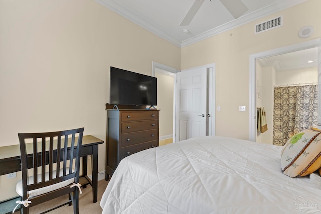 carpeted bedroom with ceiling fan and ornamental molding