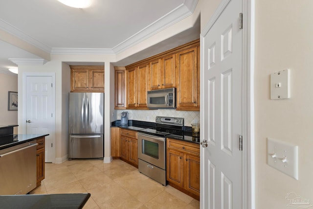 kitchen with decorative backsplash, ornamental molding, stainless steel appliances, and light tile patterned floors