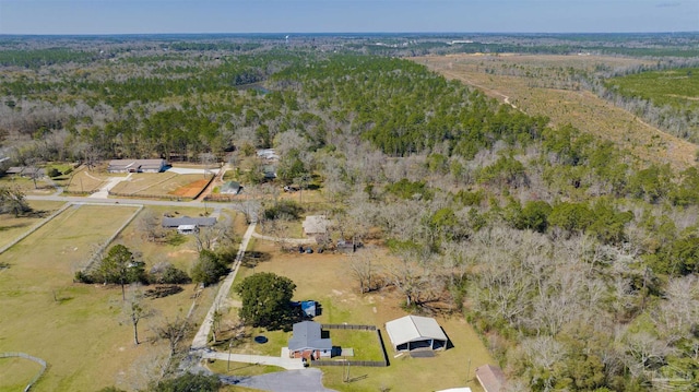 drone / aerial view featuring a view of trees