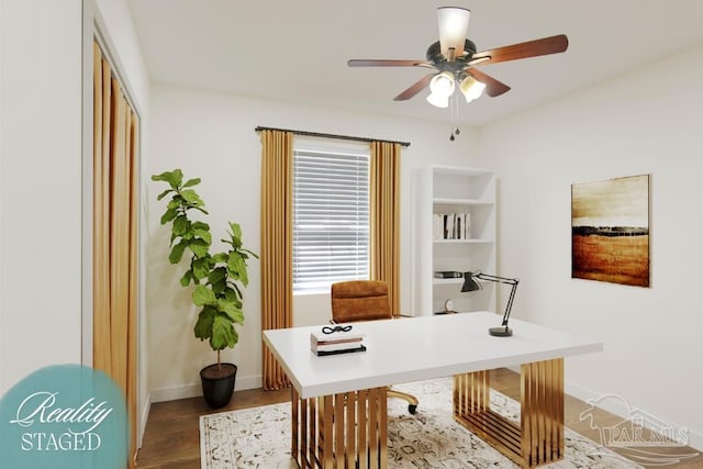 office area featuring baseboards, ceiling fan, and dark wood-style flooring