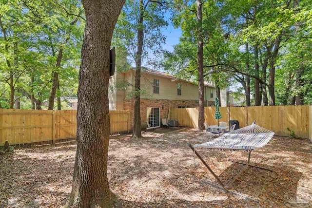 view of yard with a fenced backyard