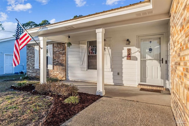 doorway to property with a porch