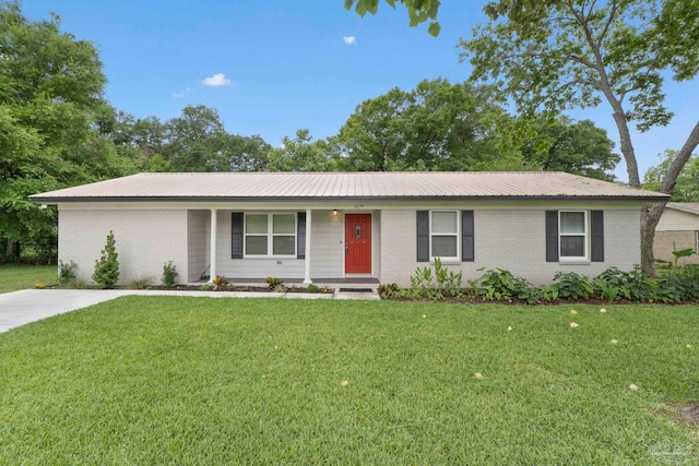 single story home with brick siding, a front yard, metal roof, and covered porch