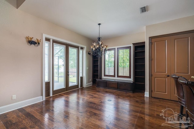4513 River Ranch Rd, Milton, FL 32583 - unfurnished dining area featuring a chandelier, wood finished floors, and french doors