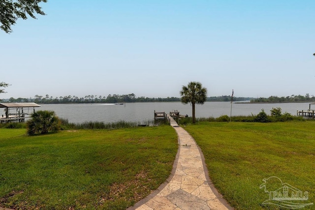 4513 River Ranch Rd, Milton, FL 32583 - view of green lawn with a water view and a boat dock