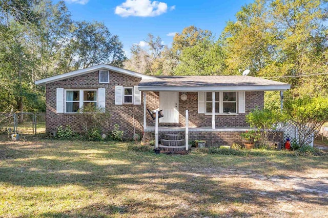 ranch-style home with a front lawn