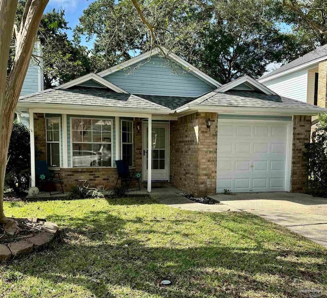 view of front of home with a garage and a front lawn